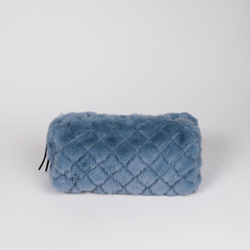 Liten makeup bag i fuskpels jeansblå